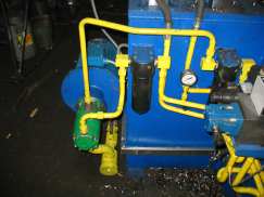 Hydraulic system of beveling machine for tee